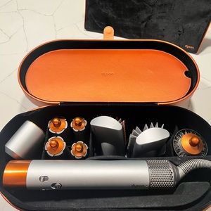 New Dyson airwrap system. Never used in perfect condition.  Includes case